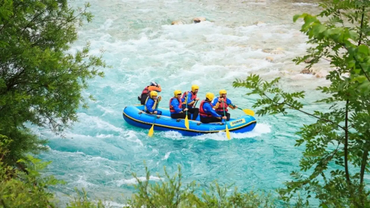 overhead view of corned beef sliced and on a platter with cabbage, potatoes, and carrots